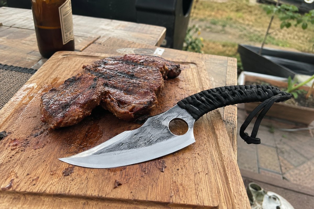 Predator knife by the backyard grill
