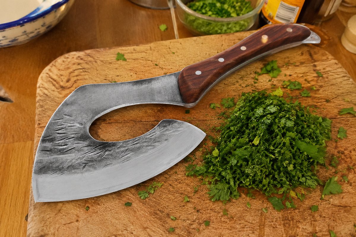 Chef axe beside minced fresh herbs